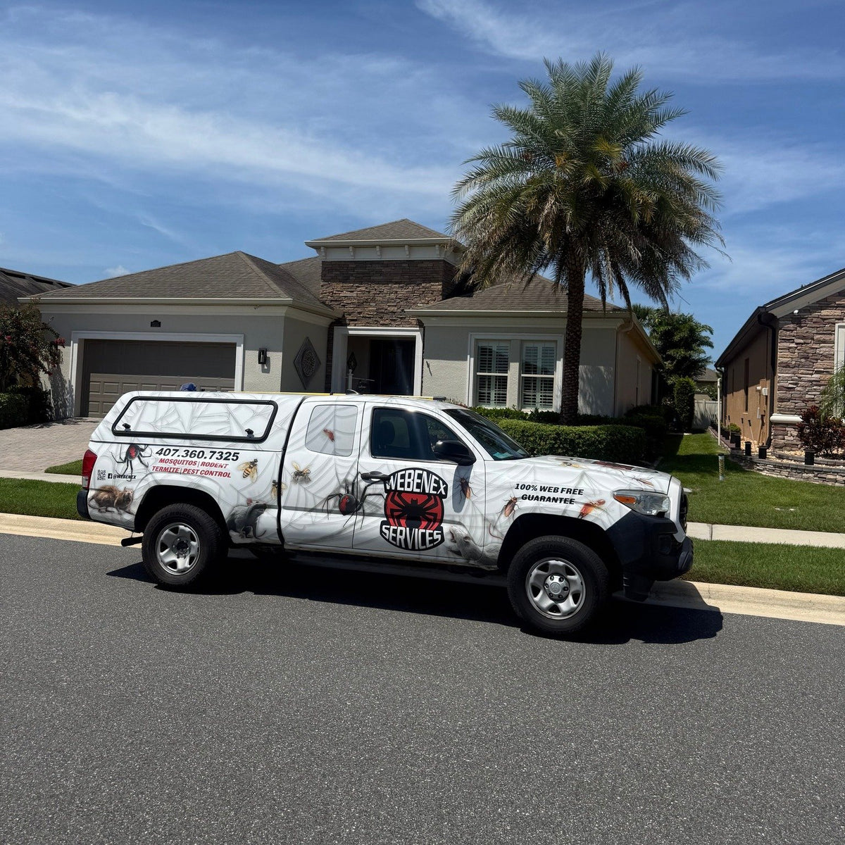 Webenex Services truck parked at the curb of a Clermont, FL home during a visit