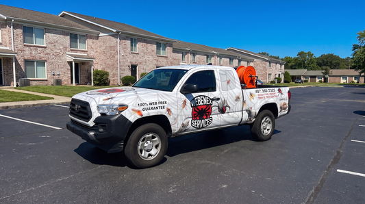 Commercial pest control vehicle providing services for multi-family residential buildings and apartments.
