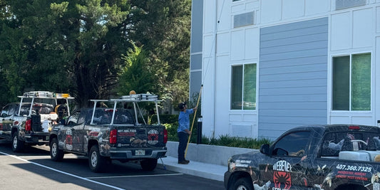 Two Webenex trucks at an apartment community