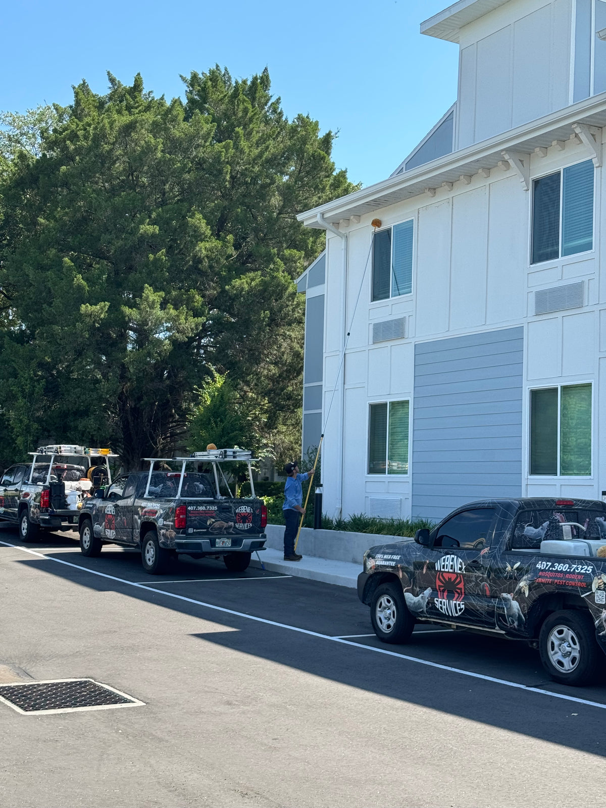 Service trucks parked at a multi-unit residential property