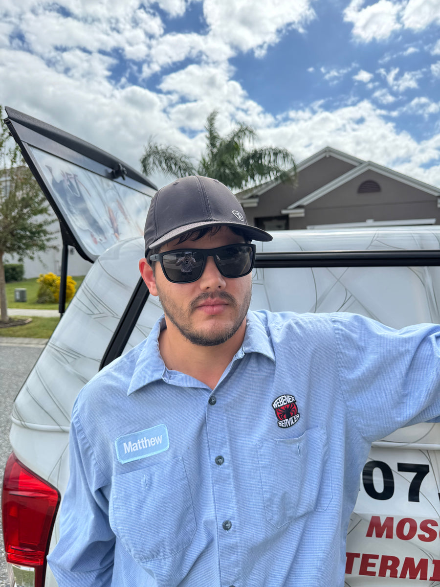 Matt Farkas beside a Webenex service truck